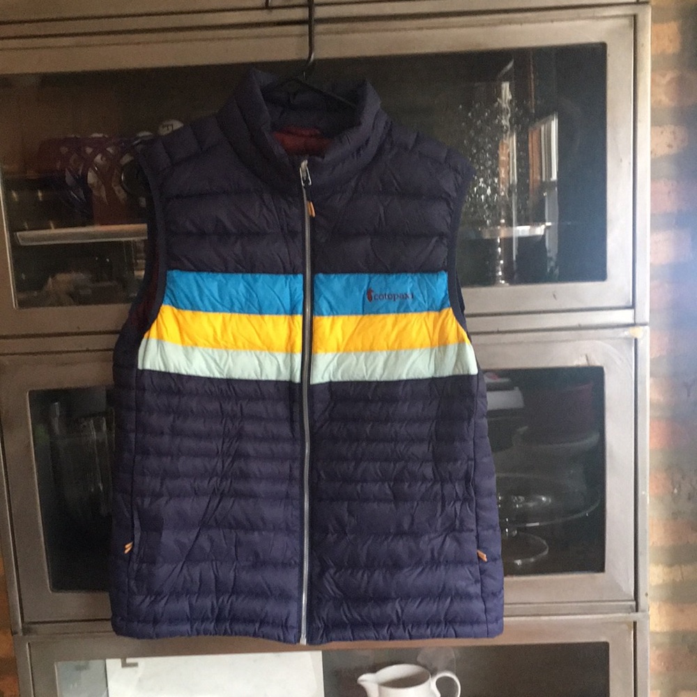 Cotopaxi down vest size medium. Navy with stripes.